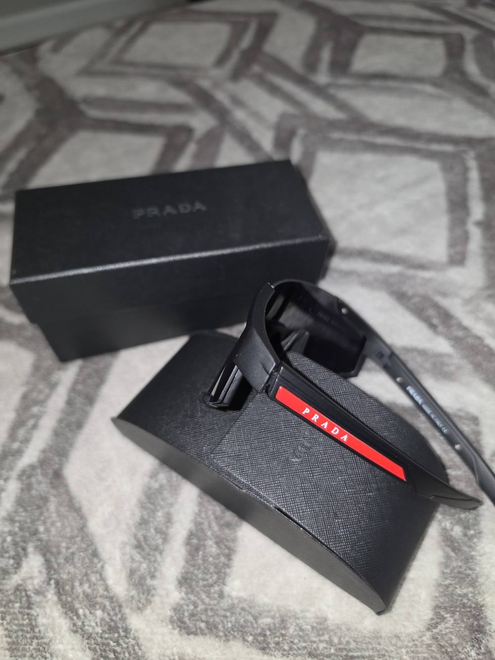 Prada Black Sunglasses with Red Temple Detail
